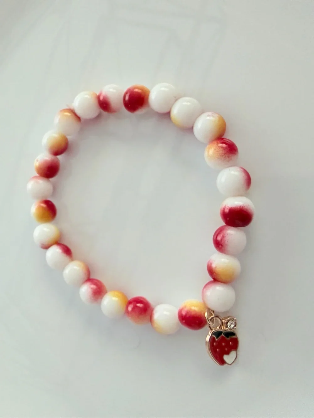 Pink & White Beaded Stretch Bracelet with Strawberry Charm
